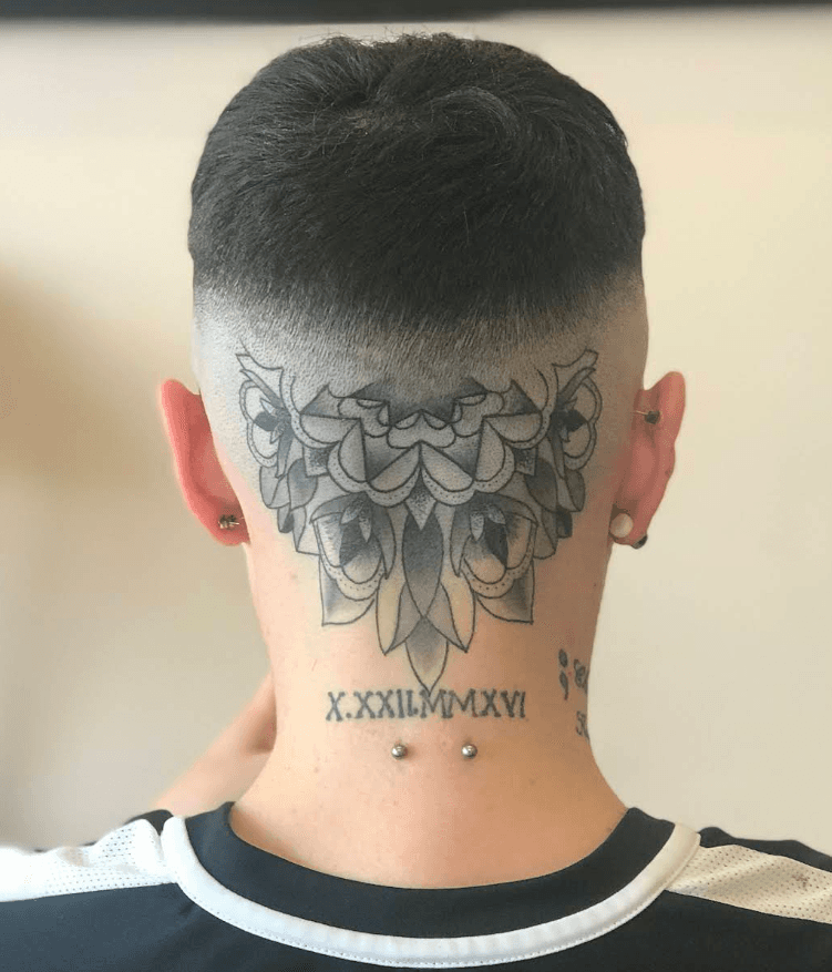 High skin fade seen from the back, clean blend to the skin